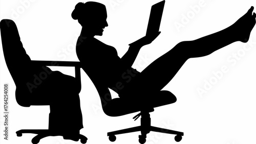 Silhouette of a woman reclining in a chair with her feet up while using a laptop computer at work desk