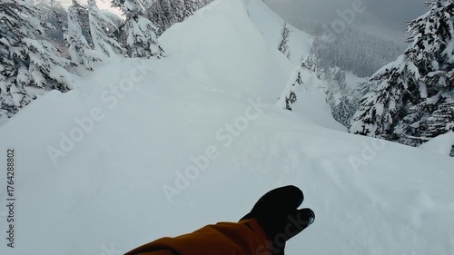 Snowboarder Riding High Mountain Ridge with Scenic View