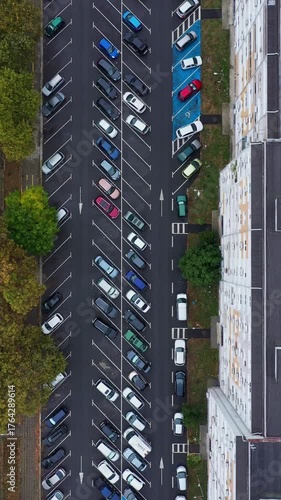 Aerial top down view of residential building and parking lot in the city