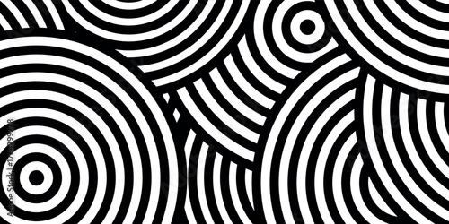 Abstract black and white concentric circles pattern, creating a visually dynamic and hypnotic design.