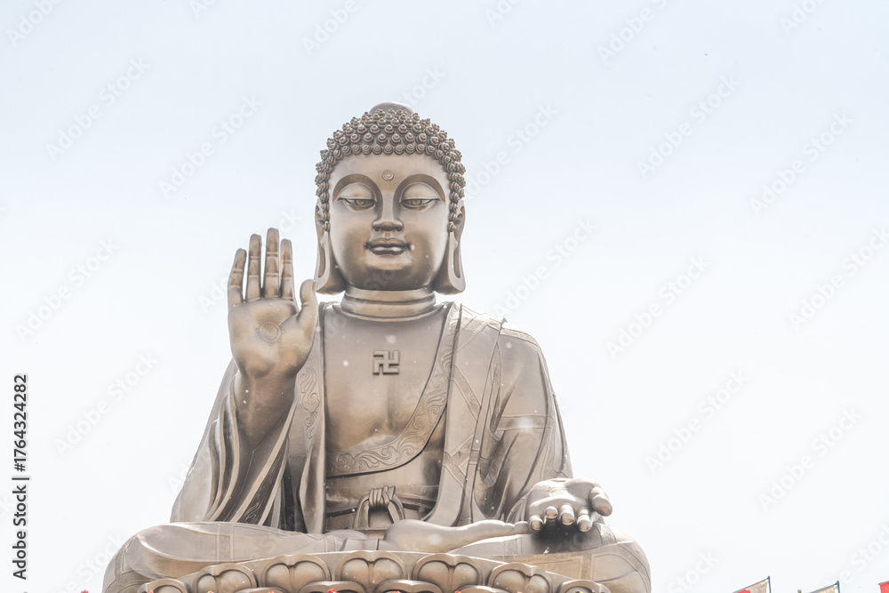Fototapeta premium The largest sitting Buddha statue in the world on a lotus flower at Nanshan Mountain in Longkou City in Lushan Mountain in Shandong Province China