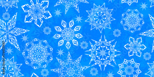 A seamless grunge pattern of broken-line snowflakes in blue. This vector artwork is ideal for urban textile design, bold wrapping paper, or a striking background.