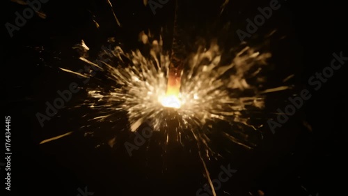 Wallpaper Mural Sparkler Burning Brightly With Glowing Embers in Dark Torontodigital.ca