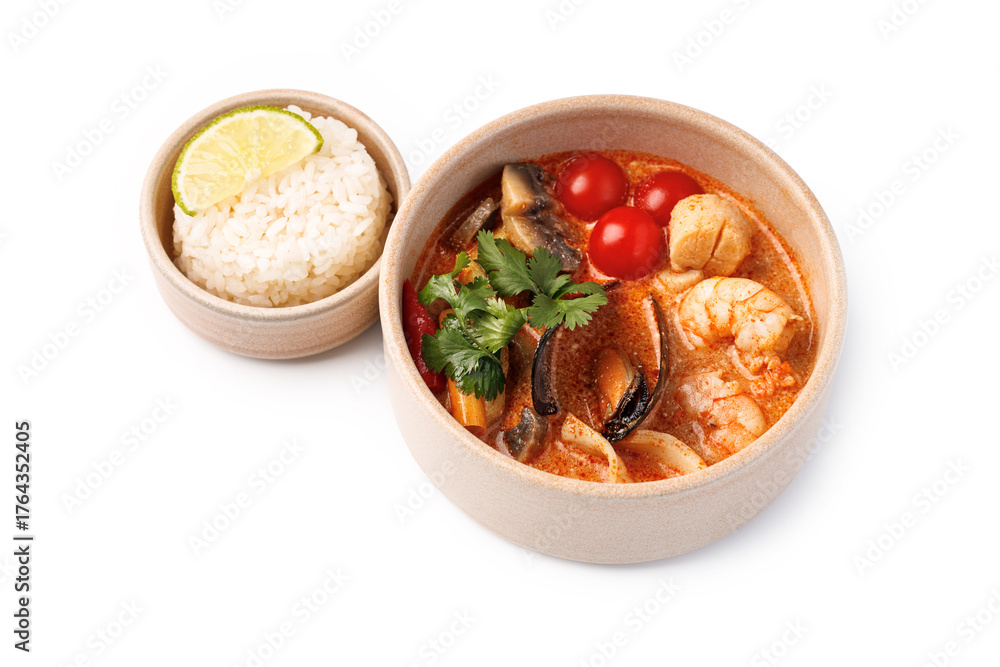 Fototapeta premium Tasty seafood dish served with fragrant rice and lime slice