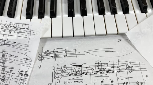 The Anatomy of a Melody: An intimate close-up of a piano keyboard featuring a composer's original handwritten score, with the intricate inner hammer mechanism of the instrument exposed