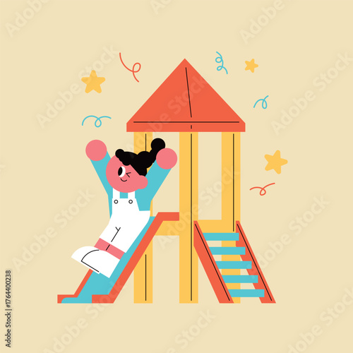 Happy child playing on a playground slide. A child sliding down a slide. A happy kindergarten student.