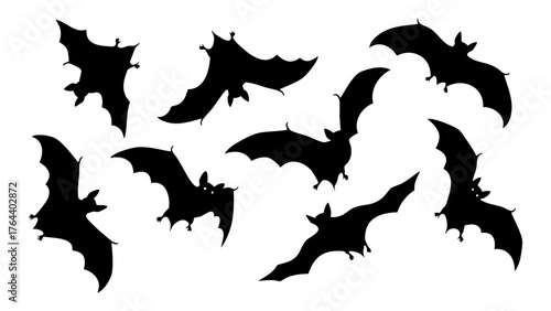 Collection of black bat silhouettes flying in different poses for Halloween design elements. Vector illustration set 410