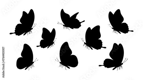 Collection of delicate flying butterfly silhouettes, capturing natural beauty and elegant movement in a versatile graphic design element