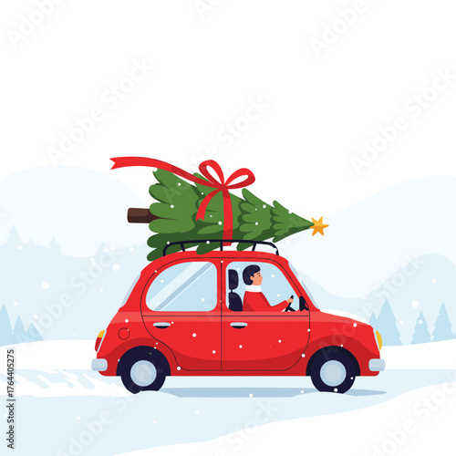 Red car with Christmas tree on roof driving in snow.