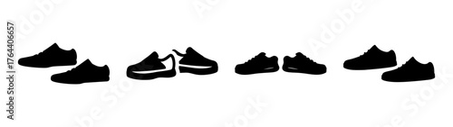 Collection of four pairs of black sneakers arranged in a horizontal line displaying different angles