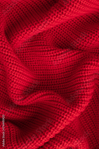 Knitted red background. Top view, vertical image