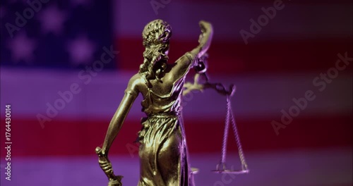 Lady Justice Bronze Statue full of dust and cobwebs against an American flag on the background