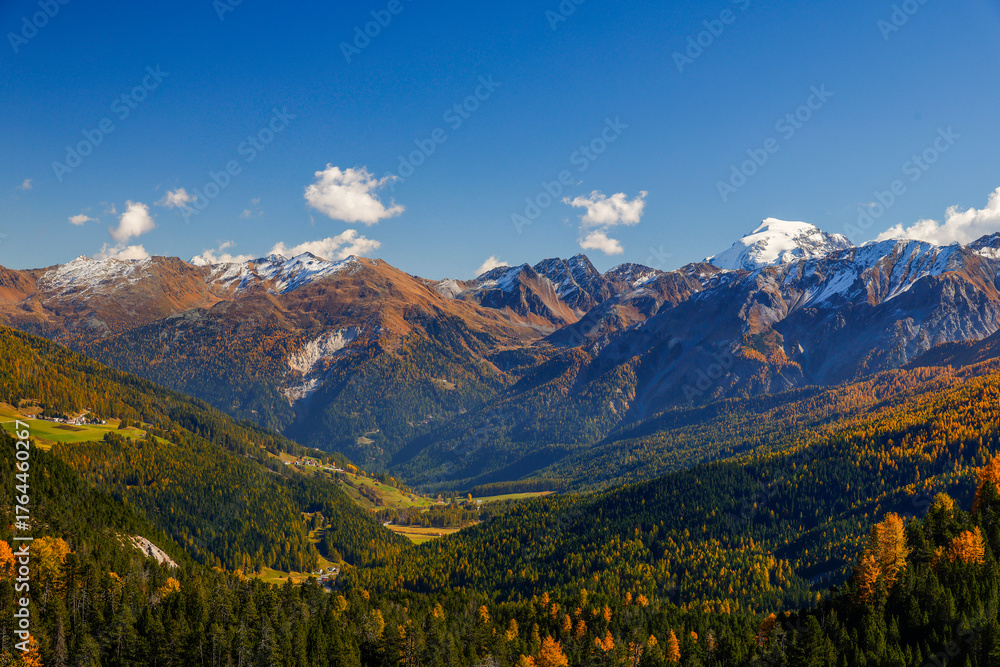 Obraz premium Autumn landscape of Val Mustair valley and Umbrail Pass of canton Grisons, Graubunden, Switzerland.