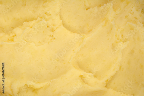 Bild auf Leinwand A detailed horizontal close-up shot of creamy, pale yellow mashed potatoes showi