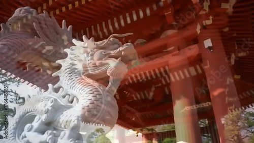 Stone dragon statue and red architecture exterior day scenic view
