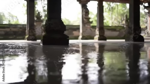 Ancient architecture interior view of stone pillars and reflective surface