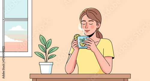 Young woman enjoying a warm cup of lemon tea.