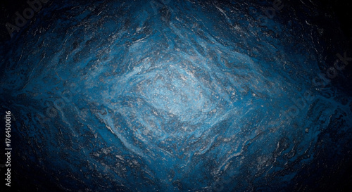 Dark Blue Textured Rock Surface Shines in Cavernous Background