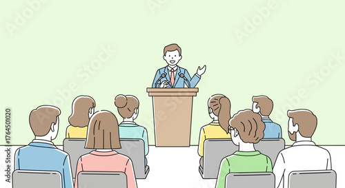 Man giving presentation to an audience from a podium.