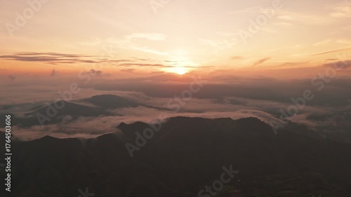 Wallpaper Mural Epic 4K drone footage of sunrise above misty mountain peaks and glowing clouds. Perfect for cinematic, travel, or inspirational storytelling visuals. Torontodigital.ca