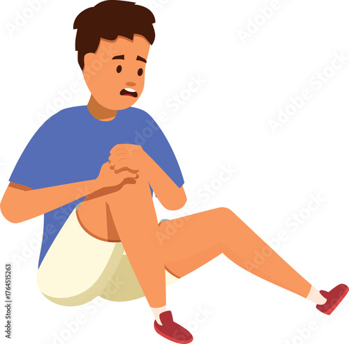Boy suffering from knee pain, holding his leg with his hands