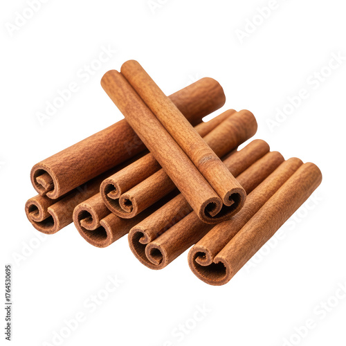 Close-up of stacked cinnamon sticks with a dark, isolated background