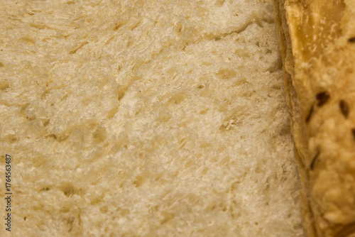 Wallpaper Mural An extreme close-up image highlighting the soft, spongy texture of freshly baked white bread alongside the flaky edge of a puff pastry. The image beautifully captures the contrast in textures Torontodigital.ca