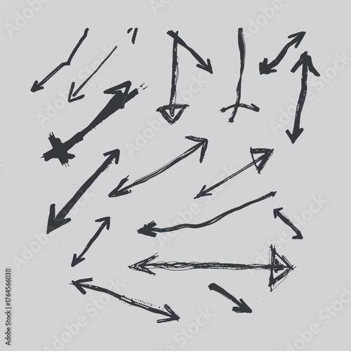 Collection of hand drawn arrows pointing in various directions on gray background