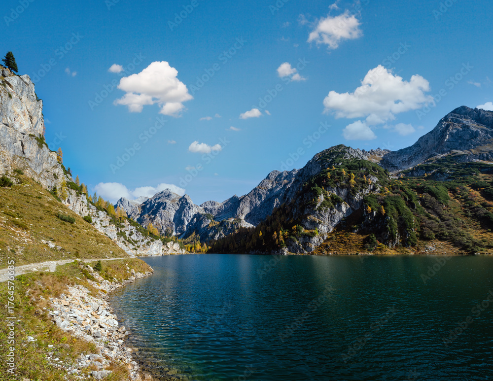 Fototapeta premium Sunny autumn alpine Tappenkarsee lake and rocky mountains above, Kleinarl, Land Salzburg, Austria.