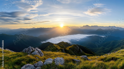 Wide panoramic mountain landscape with soft light and serene atmosphere at sunrise