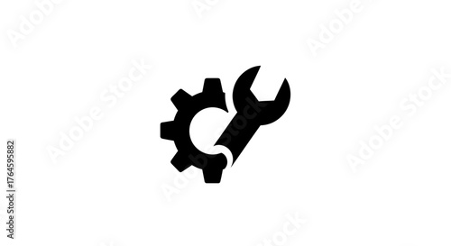 Black silhouette of a wrench and gear icon representing repair and industry.