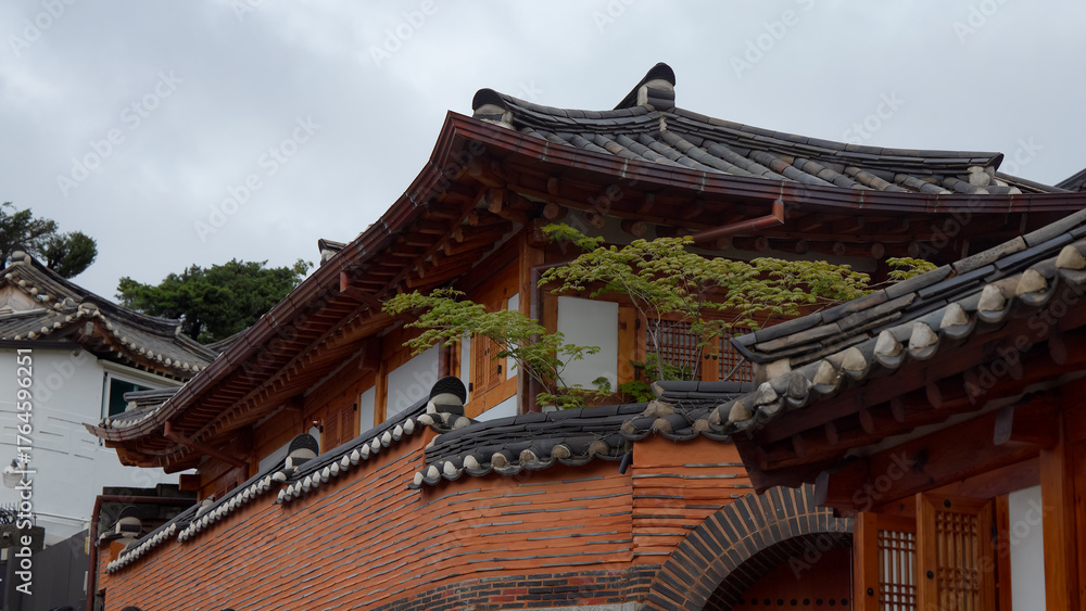 Fototapeta premium Historic hanok buildings showcasing traditional Korean architecture and classic tiled roofs