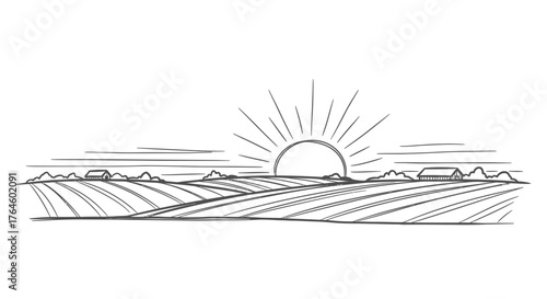 Sunrise over agricultural fields with mountains in the background  