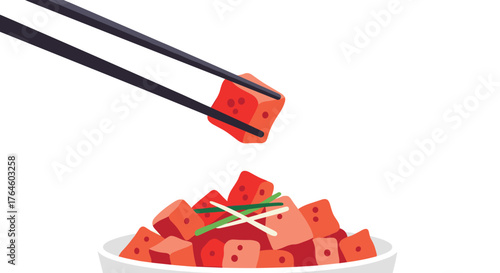 Close up of fresh tuna cubes in a bowl with chopsticks.