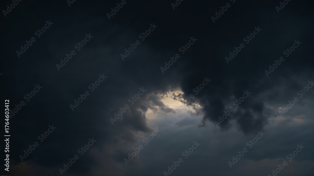 Obraz premium Dramatic and moody shot of dark storm clouds, a moment captured before the rain arrives. A captivating moment of nature's power
