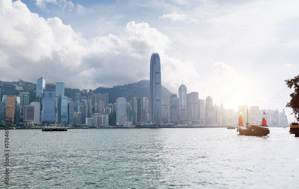 Fototapeta premium Junk boat sailing in Hong Kong Victoria Harbor