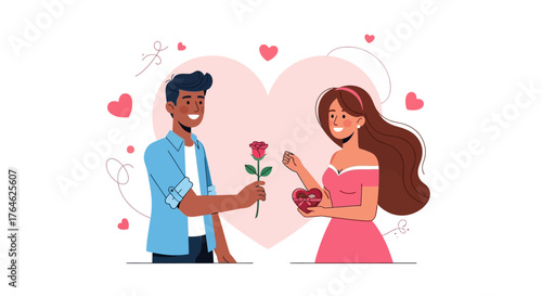 Happy young couple celebrating a romantic occasion with a man giving a red rose and a woman holding heart-shaped chocolates