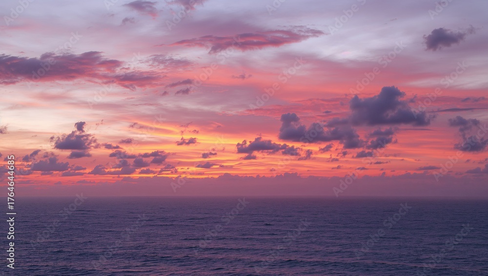 Fototapeta premium Ocean Horizon at Dusk with Fiery Clouds and Golden Hues