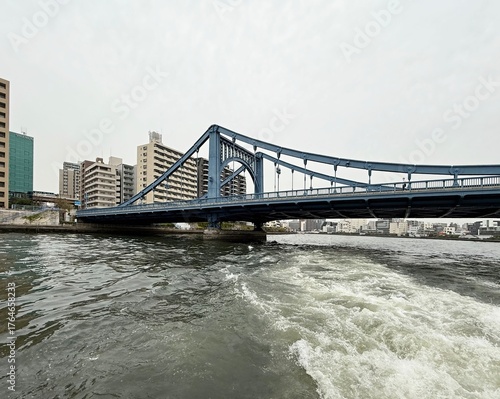 Rainbow Bridge in Tokyo, Japan. It is a suspension bridge that spans the Tokyo 