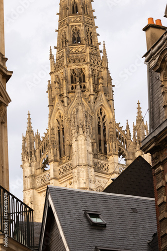 Fototapeta Naklejka Na Ścianę i Meble -  Colorful historic buildings and detailed stone architecture in Rouen, France. Charming medieval street scene showcasing European culture, history, and heritage.