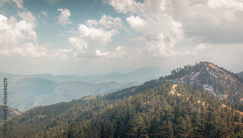 Fototapeta premium Wide-angle perspective of mountain peaks from a high-altitude trail