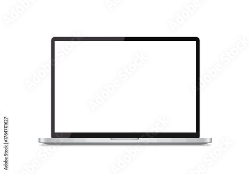 An open laptop with a blank white screen sits on a surface casting a faint shadow The device has a gray body