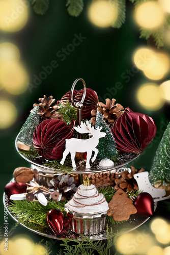 Christmas decorations with handicraft paper ornaments and other decors on tiered tray