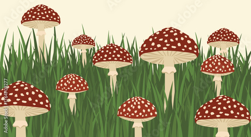 Group of red and white spotted mushrooms in a grassy field.