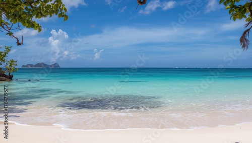 Fototapeta Naklejka Na Ścianę i Meble -  Stunning seaside vista featuring crystal-clear turquoise waves and pristine white sands under a bright sky