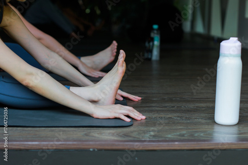 close up of the feet and hands of a person doing yoga movements