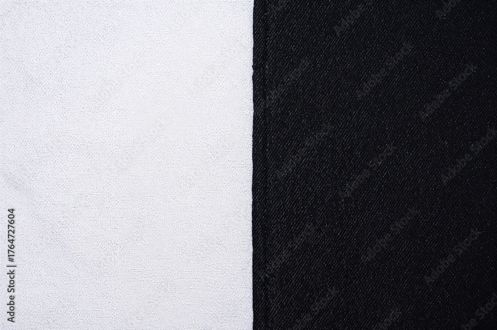Fototapeta premium Vintage black denim fabric texture on white backdrop