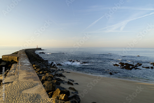 A stone pedestrian road leading into the sea, 1