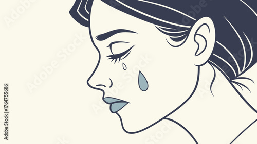 Close-up profile of a woman crying with a single tear rolling down her cheek.