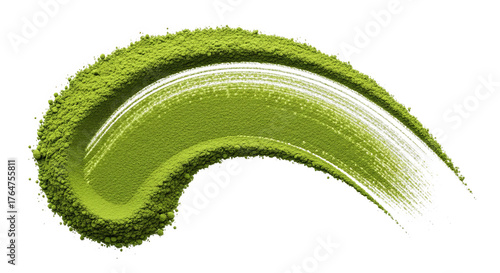 Green matcha powder in a sweeping brush stroke on black